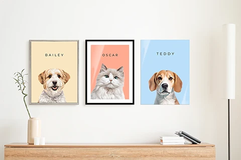 3 pet portraits arranged on a wall